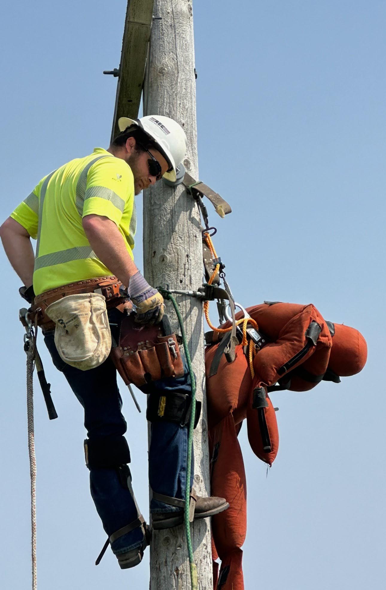 Lineman working on pole